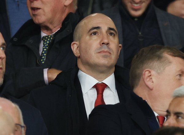 Team-up reporter: Senior executives such as Bellada, Wilcox and Vivier watched Manchester United on the spot